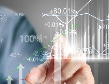 A person is touching a graph on the screen.