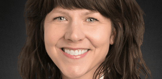 Smiling professional woman with brown hair